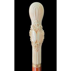 Stick With Knurled Globular Ivory Knob With Engraved Shields, Festoons And Floral Motifs. 