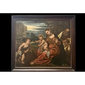 Huile sur toile représentant la Sainte Famille avec saint Jean enfant. 