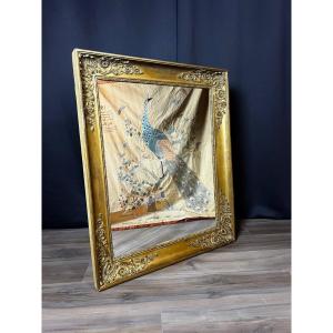 A Carved, Gilded Wooden Mirror In The Empire Style