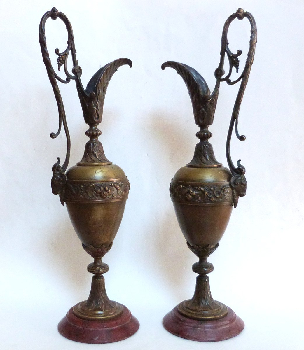 Pair Of Bronze Ewers Decorated With Rams' Heads, Marble Base