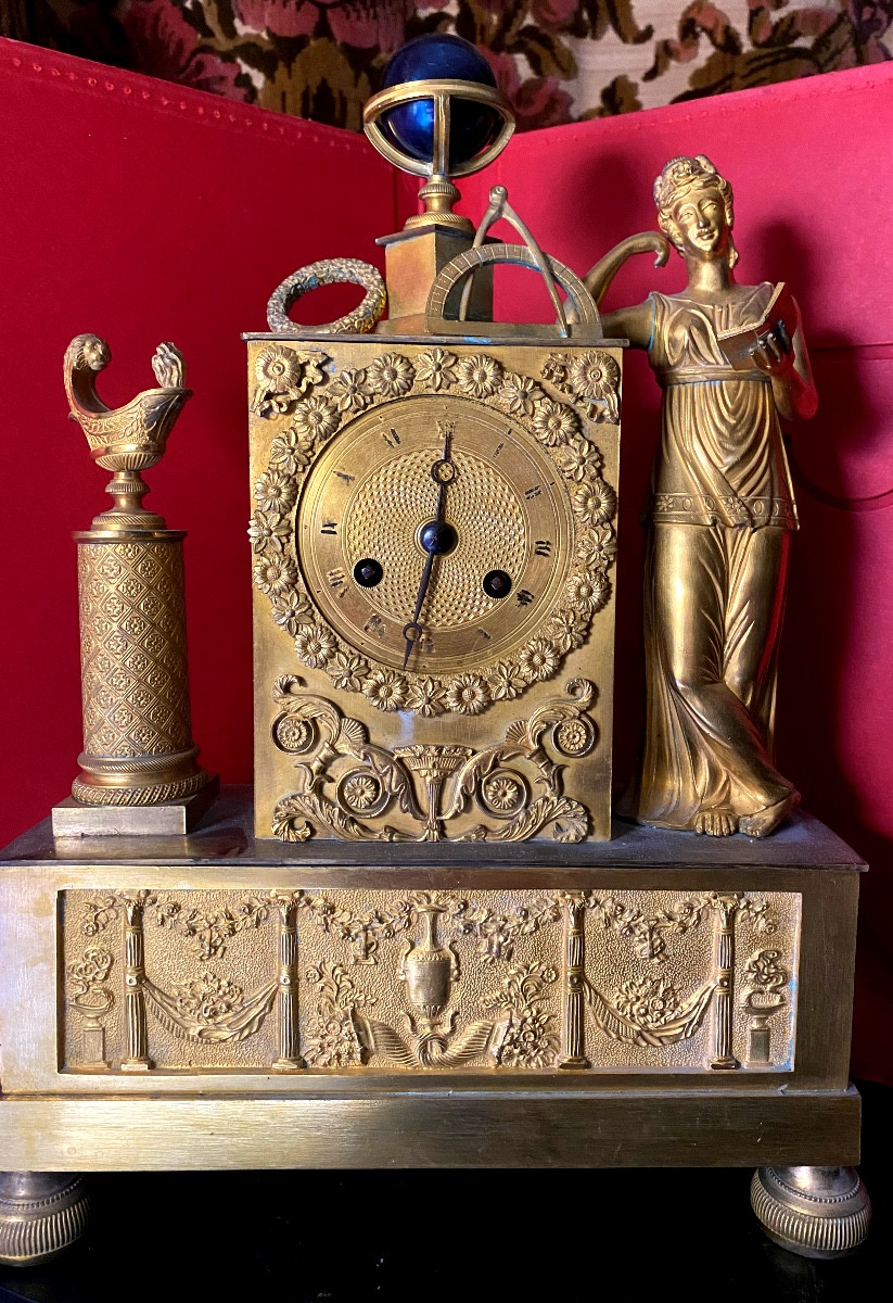 Charles X Mantel Clock, Gilt Chased Bronze With A Motif Of The Geographical Sciences & Reading