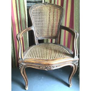 "child's Armchair" From The 18th Century. Caned Cabriolet In Patinated Walnut, Well Carved From The Louis XV Period.