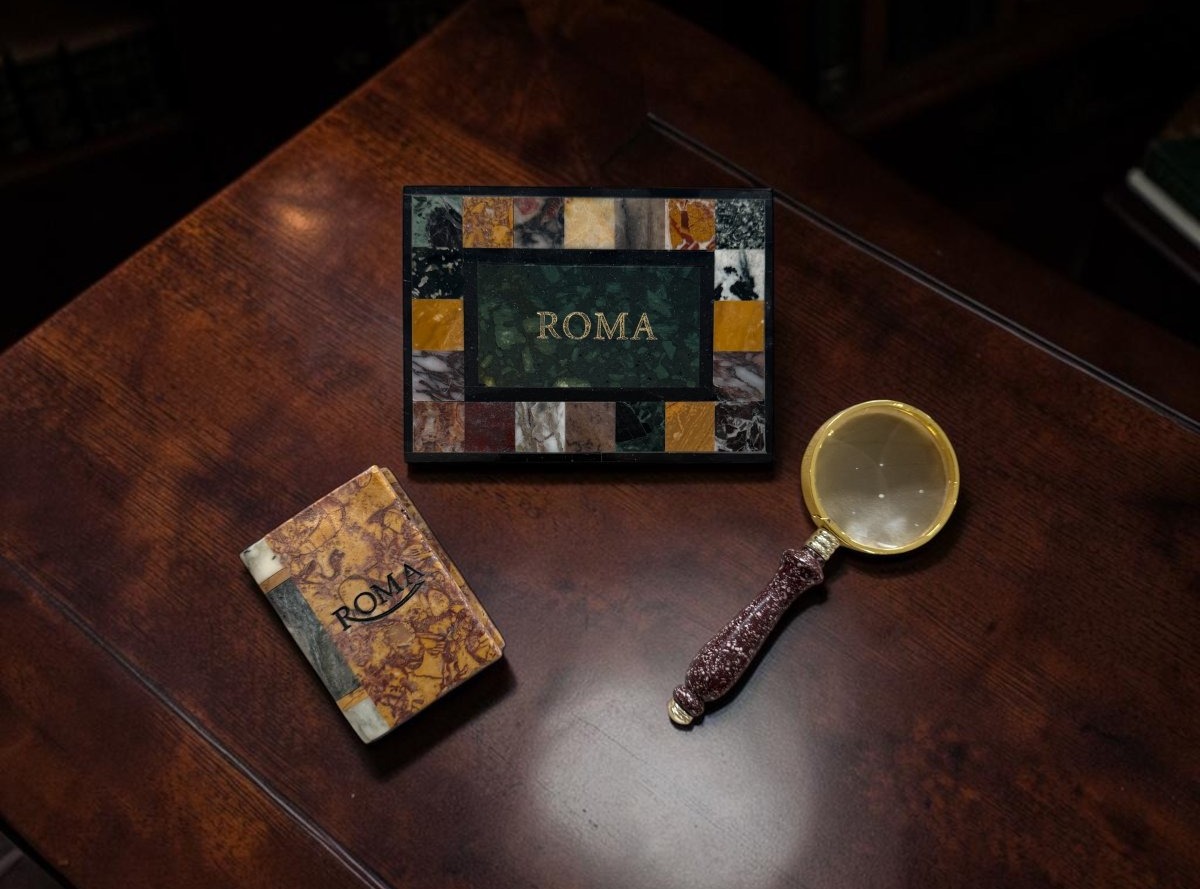 Three Souvenirs From The Grand Tour: Two Polychrome Marble Paperweights And A Magnifying Glass