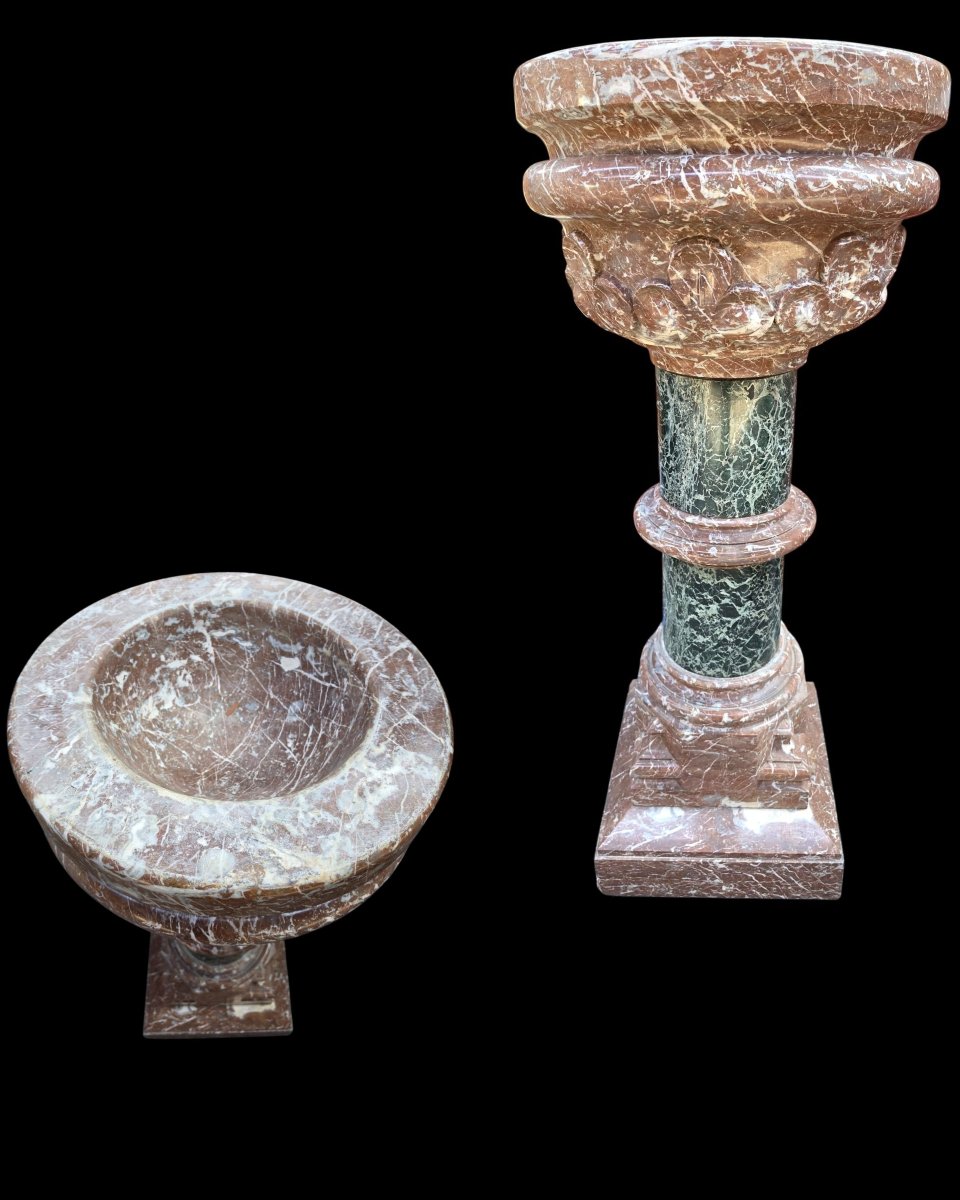 A Set Consisting Of Two Columns And A Marble Font.-photo-3