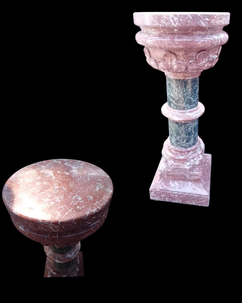 A Set Consisting Of Two Columns And A Marble Font.-photo-4