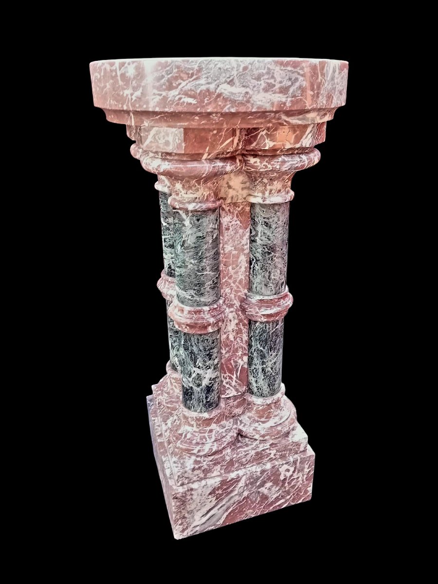 A Set Consisting Of Two Columns And A Marble Font.-photo-2
