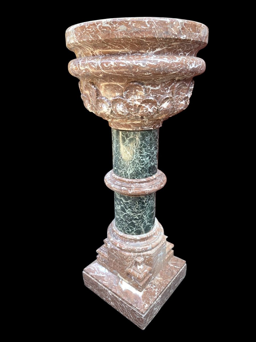 A Set Consisting Of Two Columns And A Marble Font.-photo-3