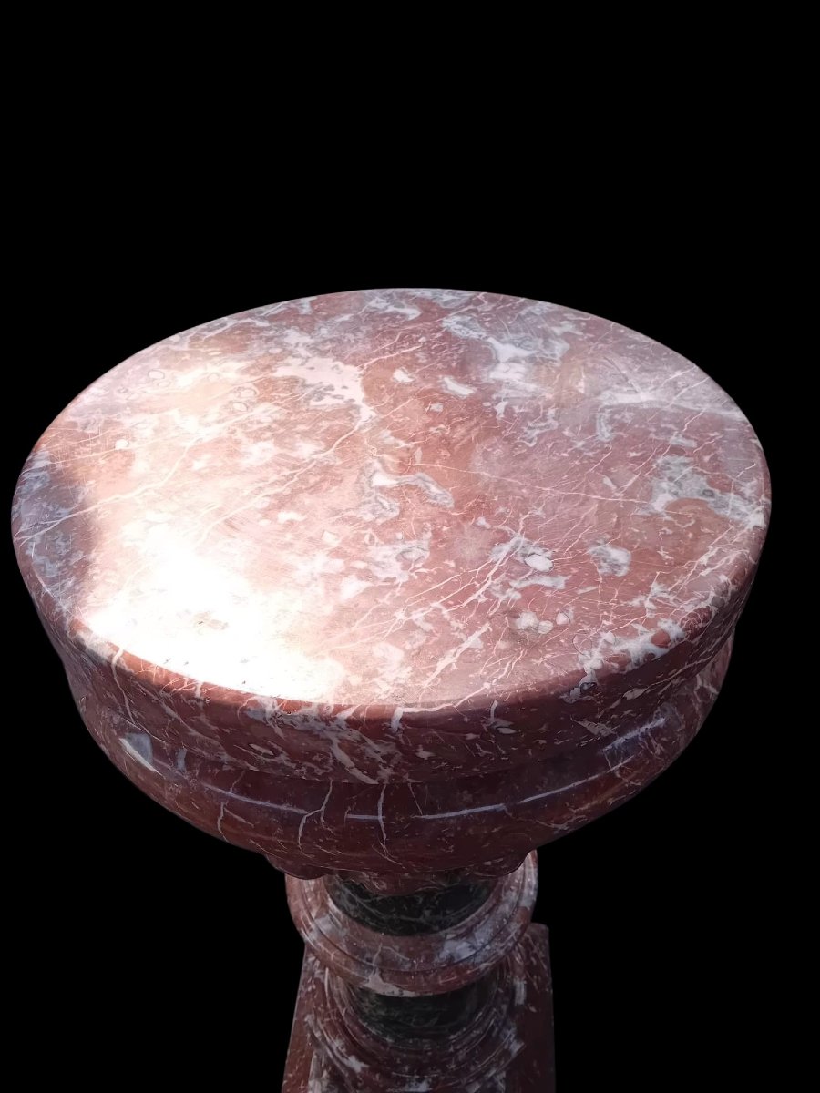 A Set Consisting Of Two Columns And A Marble Font.-photo-4