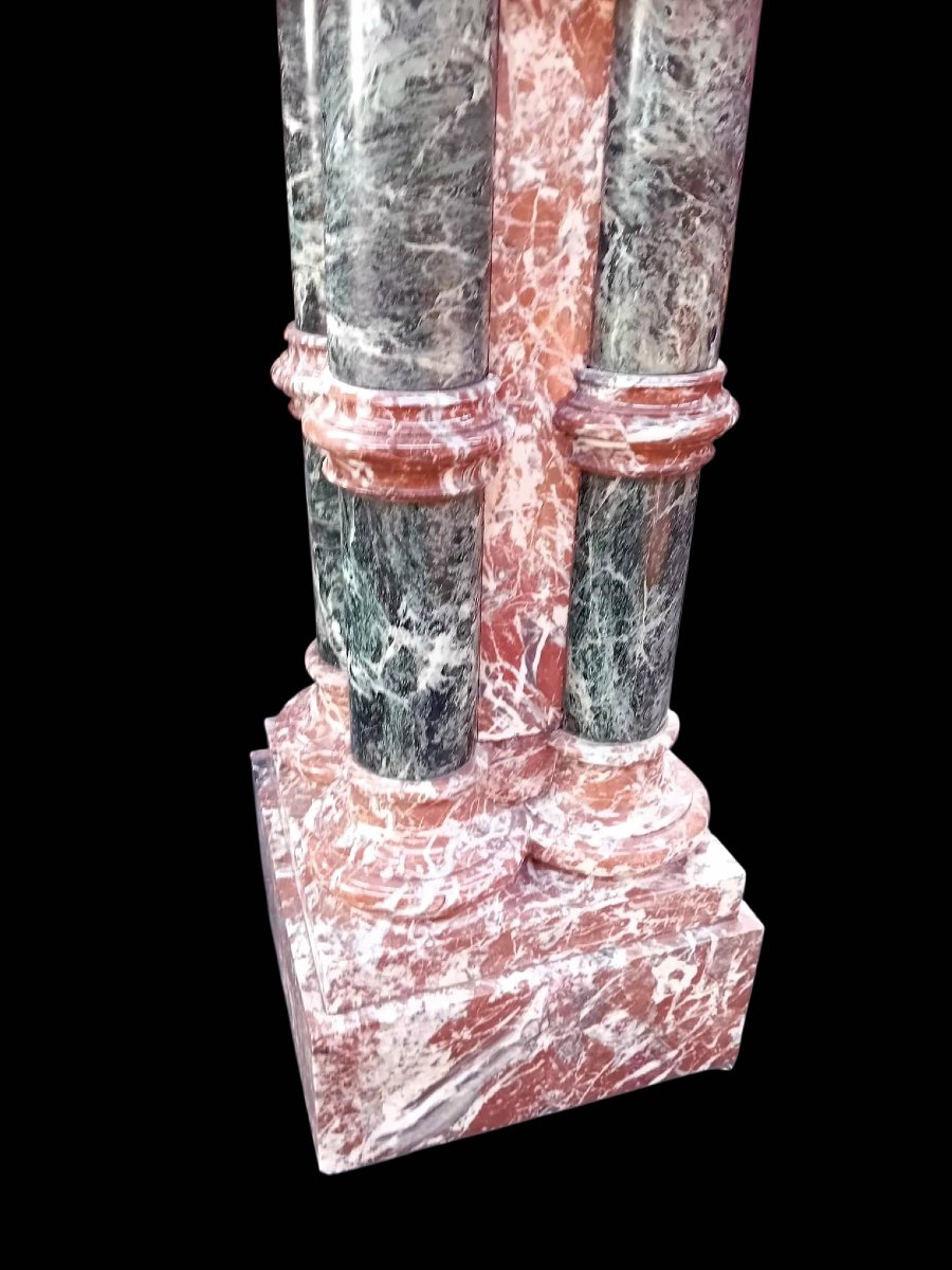 A Set Consisting Of Two Columns And A Marble Font.-photo-5