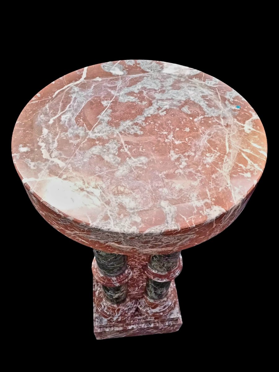 A Set Consisting Of Two Columns And A Marble Font.-photo-8