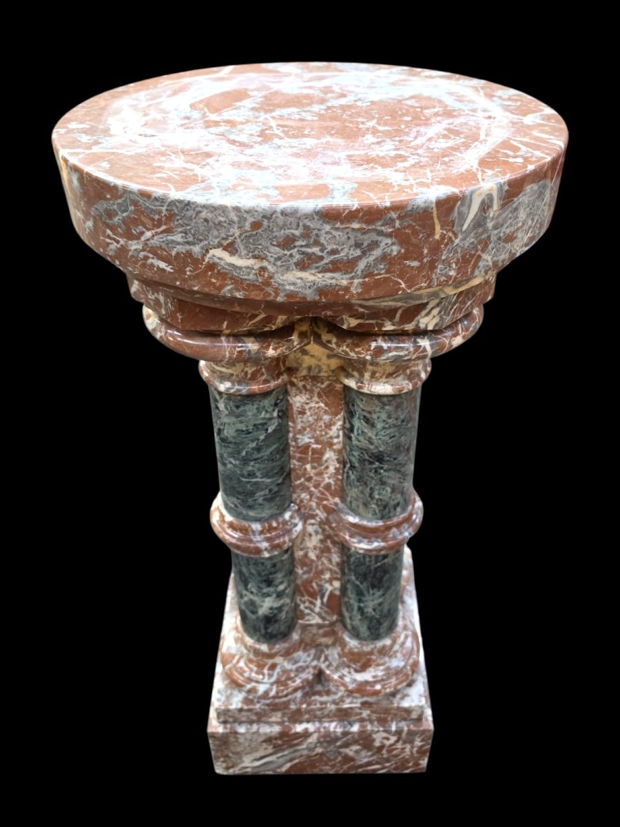 A Set Consisting Of Two Columns And A Marble Font.-photo-3