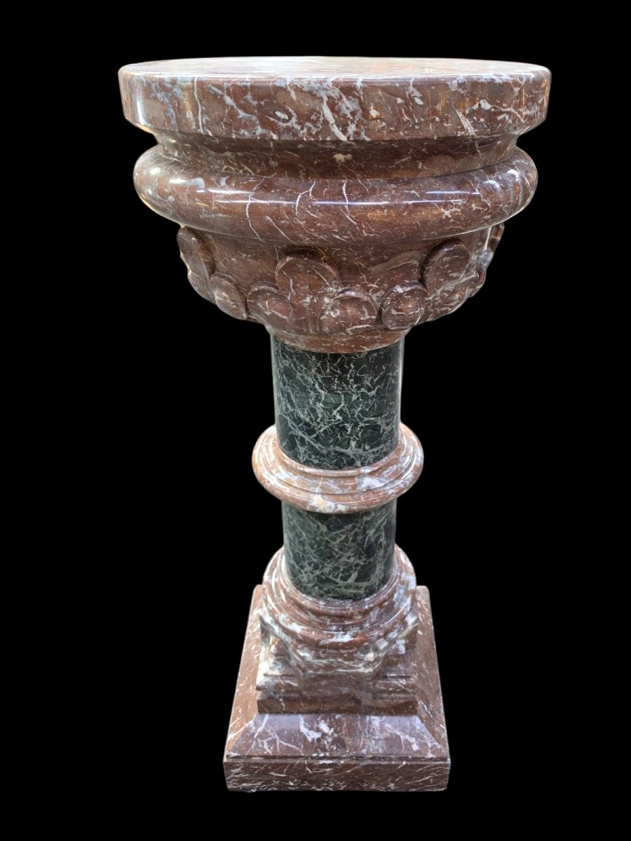 A Set Consisting Of Two Columns And A Marble Font.-photo-7