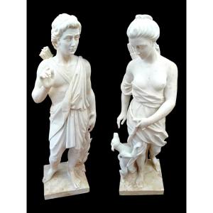 A Pair Of Statues Made Of White Carrara Marble.
