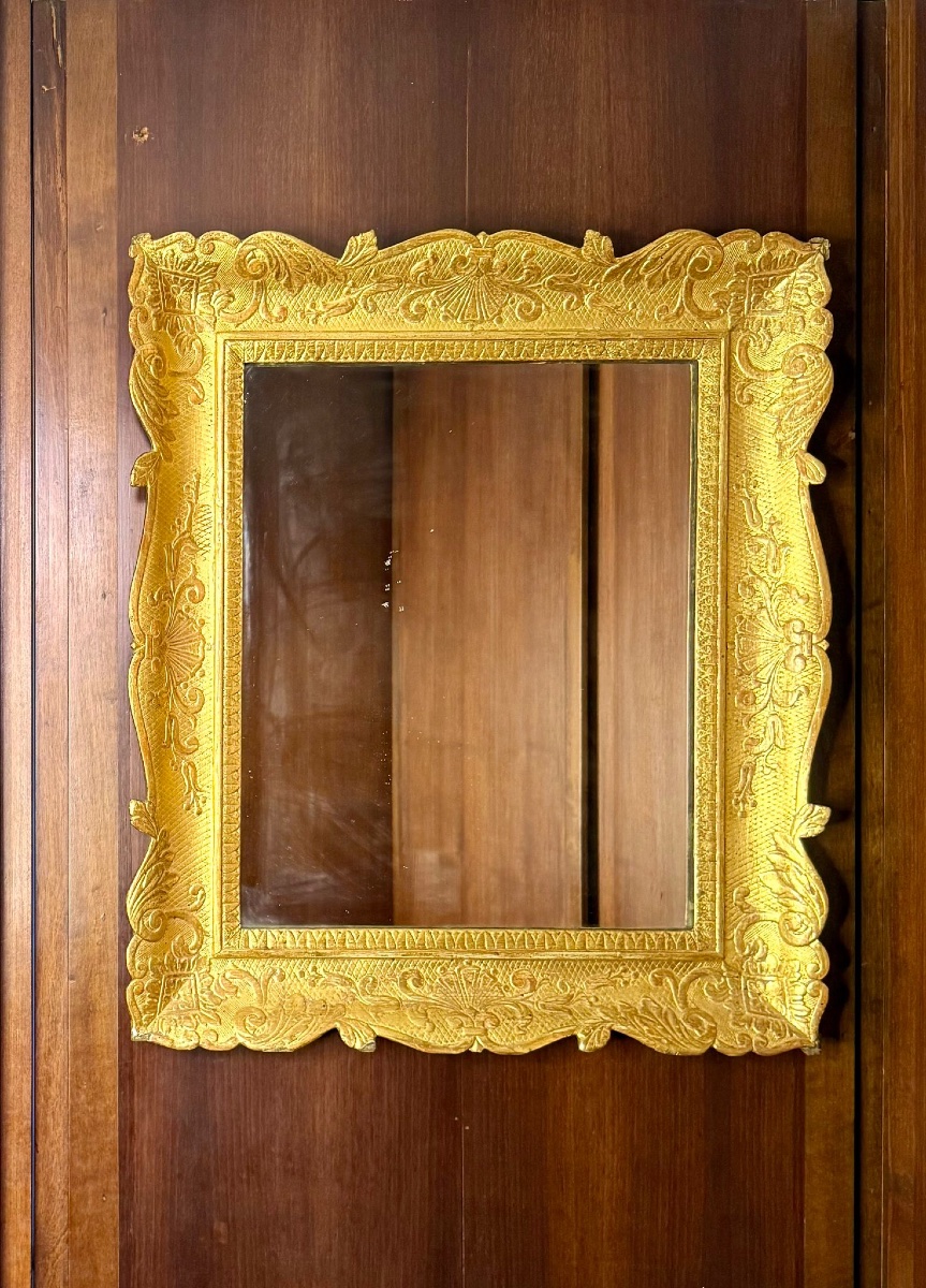 Miroir en bois doré et sculpté