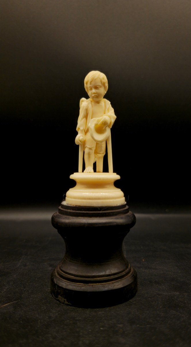 19th Century Antique Ivory Sculpture – Begging Putto On Ebonized Wooden Base