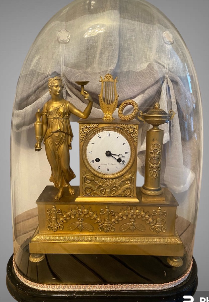 Gilt Bronze Clock From The Empire Period Offered By Antiquités. Victor Lardin.