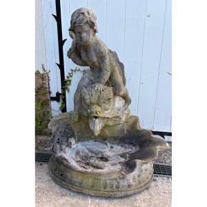 Fontaine bassin enfant chevauchant un poisson