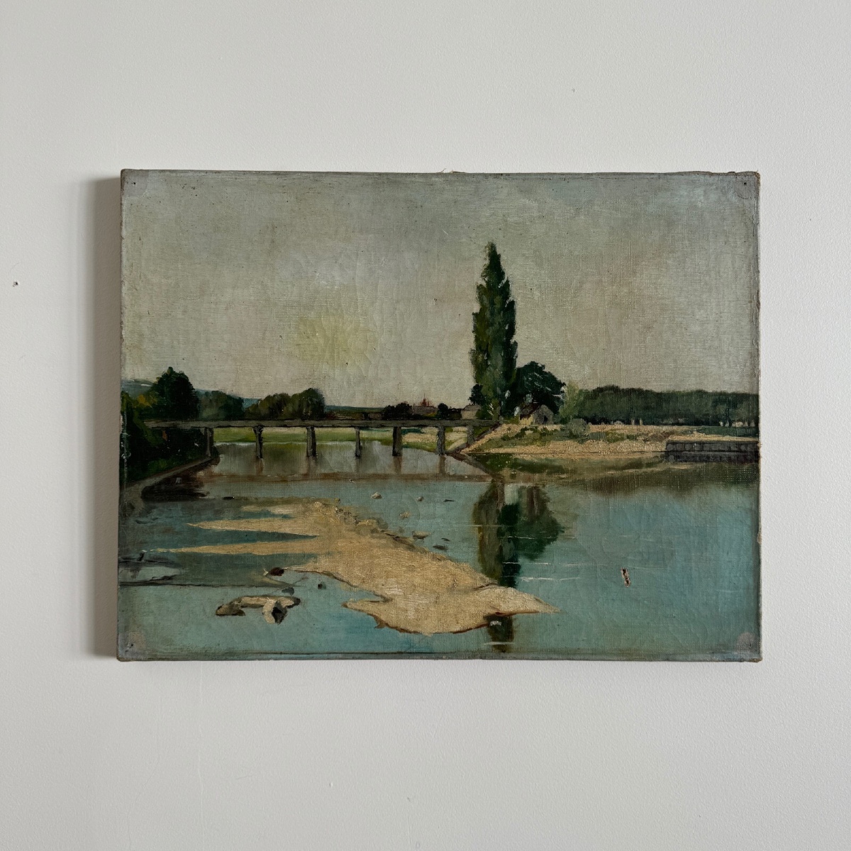 Huile sur toile représentant un cours d'eau avec un pont début XXe