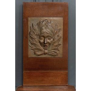 Plaque Art déco visage de femme cubisant 1930 porte en bois