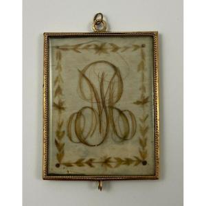 Pendentif en or avec poinçon XIXe travail de cheveux