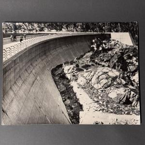 Black And White Photograph From 1960 Depicting A Dam 