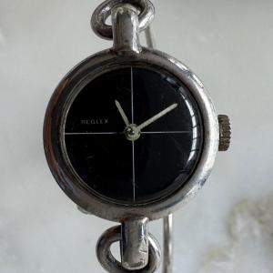 Montre Reglex en argent bracelet rigide 