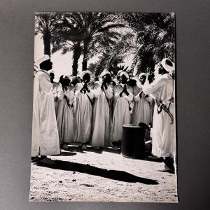 Black-and-white Photo From 1960 Depicting A Group Of People From The East