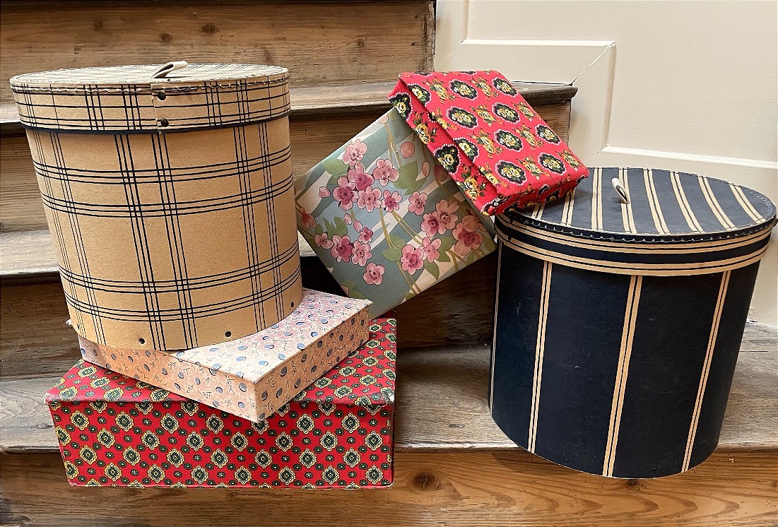 The Set Of Fabric And Cardboard Boxes 