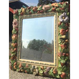 Beveled Mirror In Painted Stucco Decorated With Flowers And Fruits