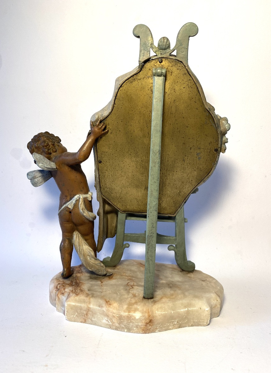 Miroir de table sur un chevalet dévoilé par un angelot. Métal patiné et marbre XIXème. -photo-2