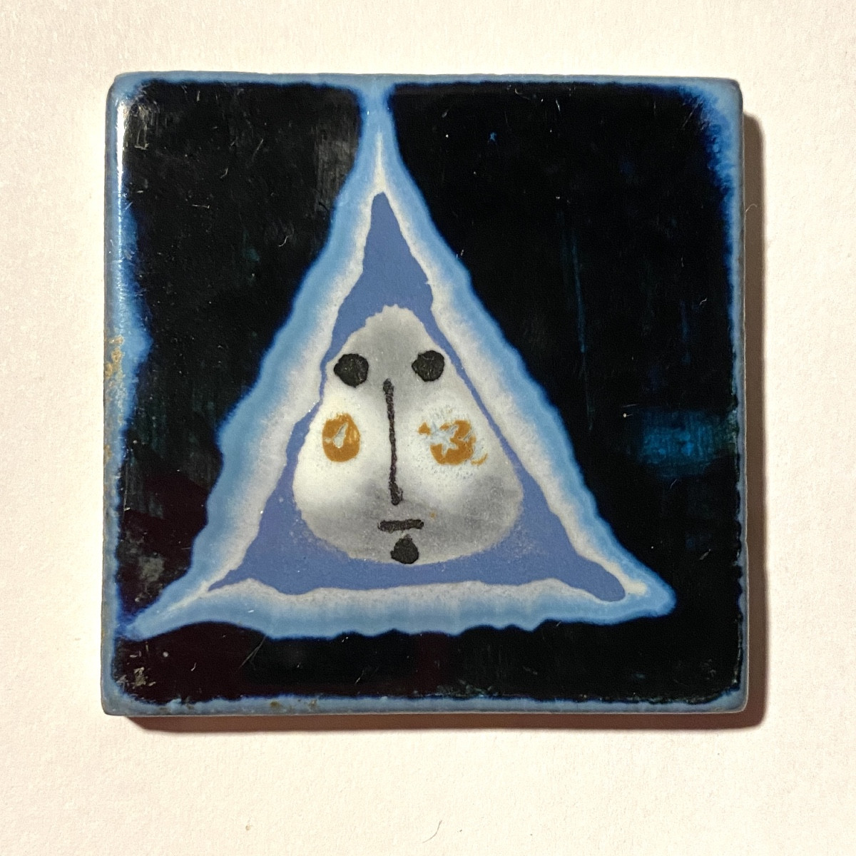 Roger Capron. Ceramic Tile, Mid 20th Century. Small Blue Face.