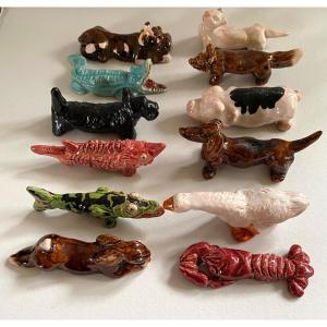 Aimé Seau. 12 Knife Holders. Glazed Ceramic. Animal Subjects. Unique Pieces. Indochina.