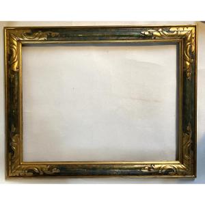 Cadre en bois style florentin milieu XXème. Patine verte et or. Coins Sculptés et dorés. 