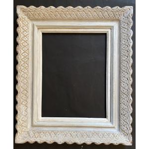 Emile Bouche. Cadre en bois massif sculpté et patiné. Années 40.