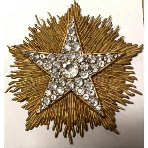 Grande étoile veilleuse de cierge XIXème. Strass sur fond rayonnant en laiton doré. 