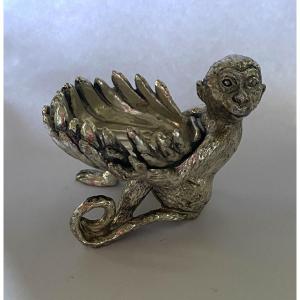 Salt Cellar In Silver Plated Metal. Seated Monkey Holding A Shell.