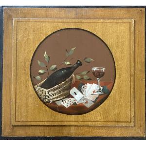 « Nature morte. Le vin et le jeu de cartes ». Panneau décoratif. Huile sur bois XIXème.