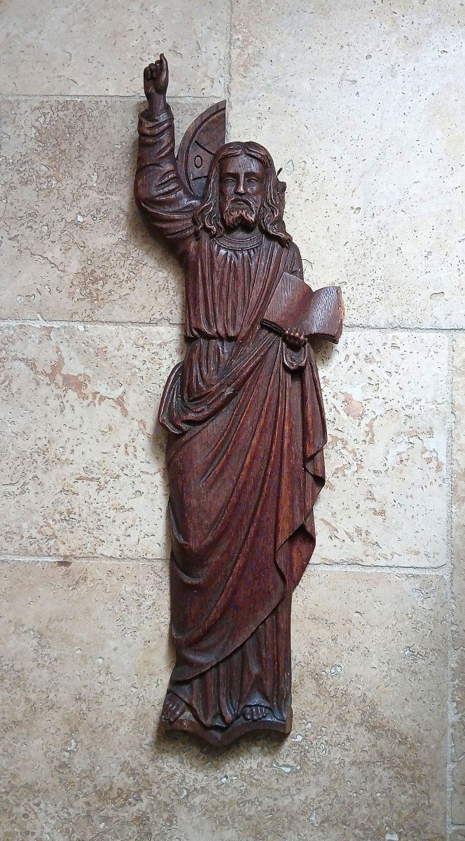  Christ présentant les écritures. Panneau sculpté.
