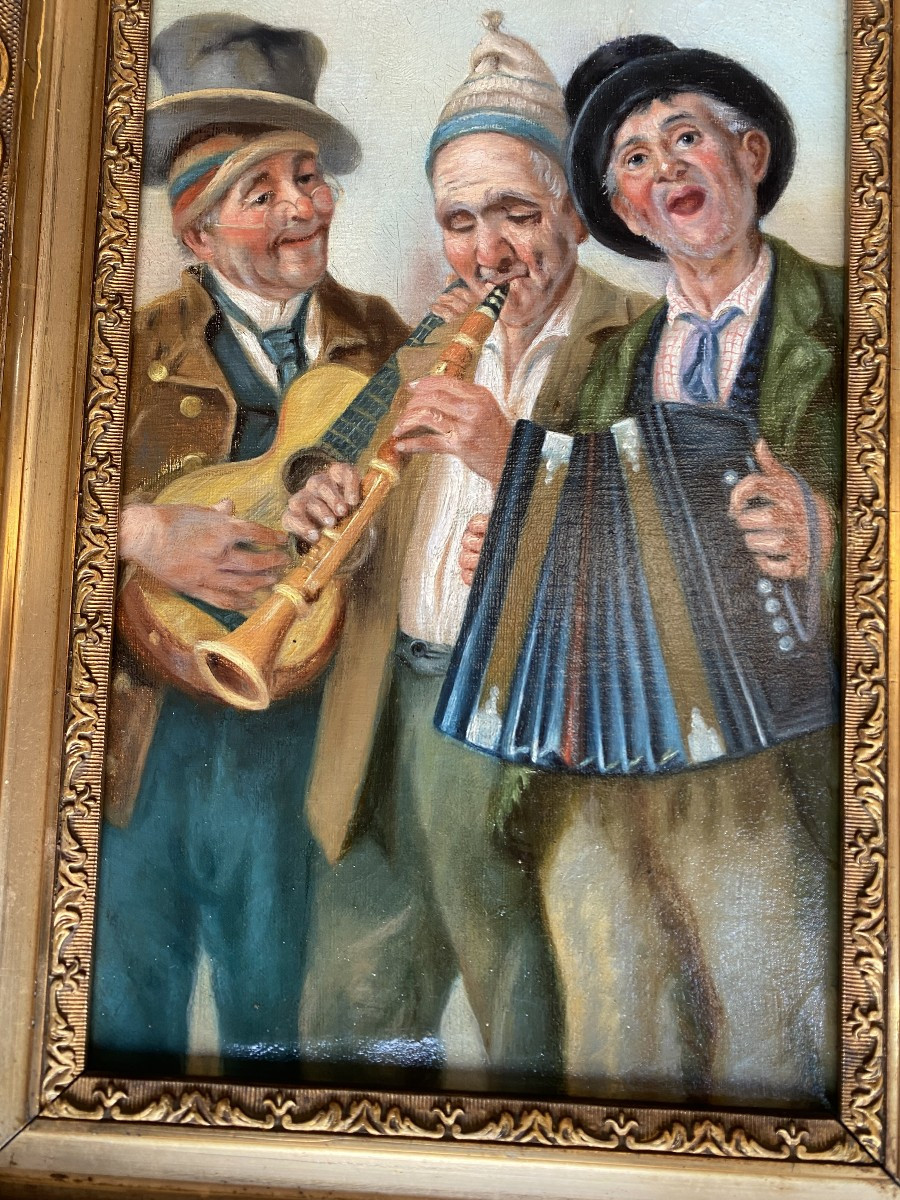 Huile sur toile représentant 3 musiciens jouant avec leurs instruments.