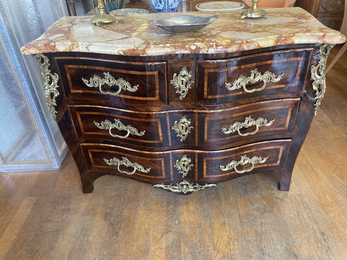 An 18th-century Louis XV Chest Of Drawers, Made Of Veneered Wood.