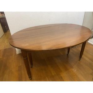 Oval Table With 6 Walnut Legs, 3 Extensions, Seats 12.