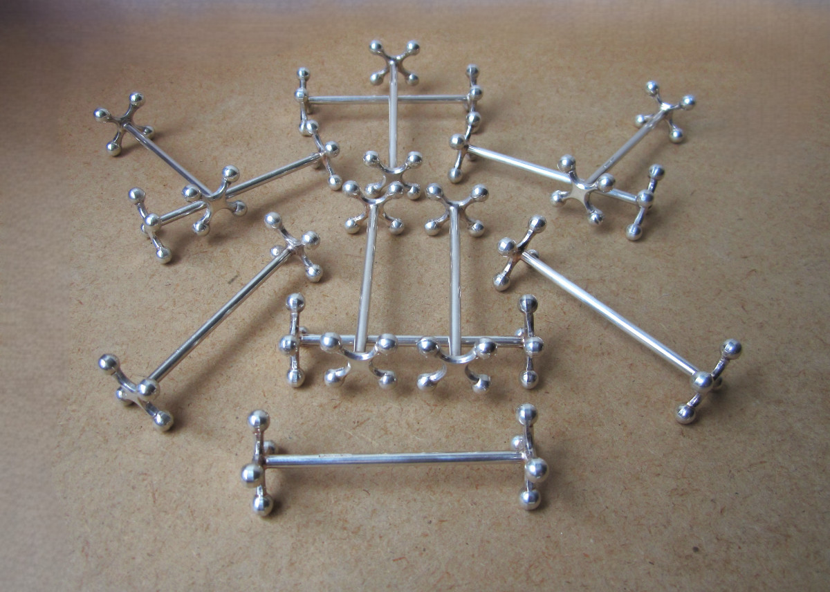 12 Christofle Knife Rests In Very Good Condition, 4 Ball Or Atomium Model, In Boxes.