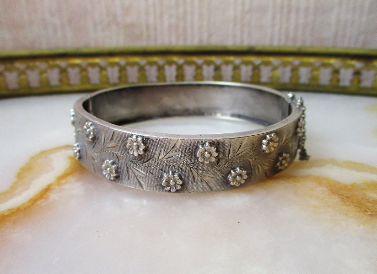 A Beautiful Solid Silver Bangle Bracelet Decorated With Small Flowers, Made In France Around 1920.