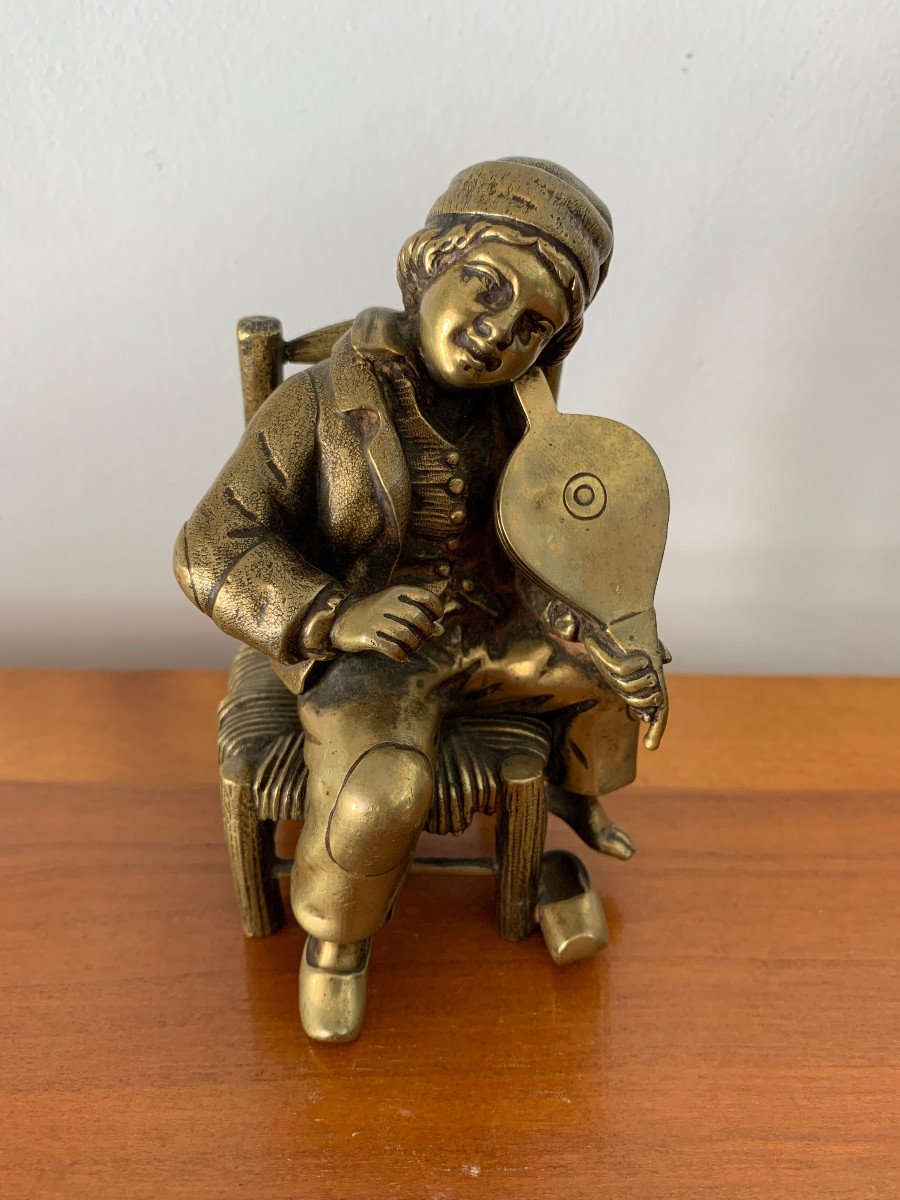 Bronze Newsboy Playing The Violin With A Bellows