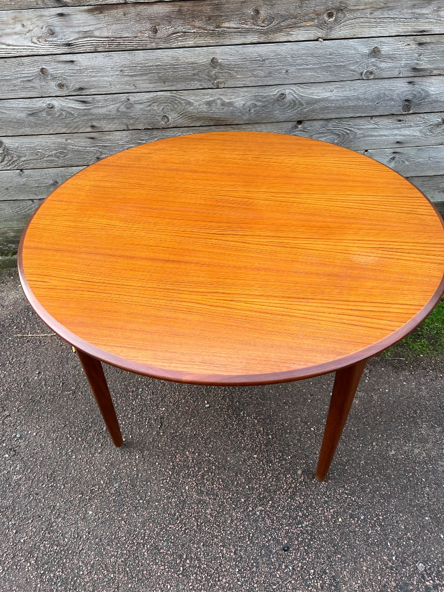 Table ronde à bandeau 4 pieds en teck , modèle à rallonges.-photo-4