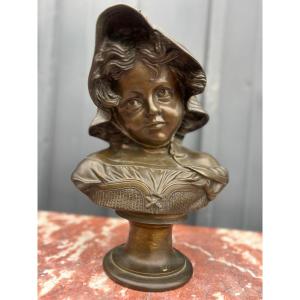 Bust Of A Young Girl With A Hat. Bronze
