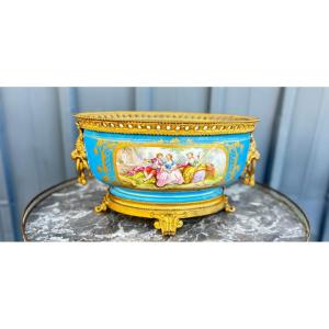 Oval Porcelain Cup Decorated With A Romantic Scene And Flowers On A Sky-blue Background, With A Gilded Bronze Rim.