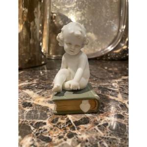 Müller Manufacture Biscuit Depicting A Little Boy Sitting On A Book.