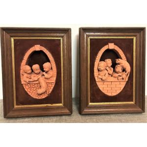 Two Framed Terracotta Sculptures Of Cats And Children, Early 20th Century