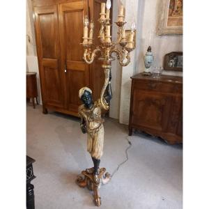 Nubien porte-torchère, bois sculpté polychrome, fin 19ème.